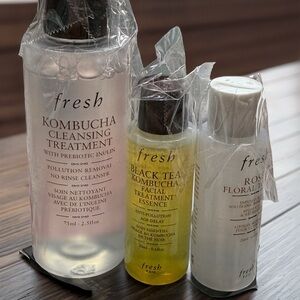 Fresh Skincare Essentials Set with Black, Yellow, and White Bottles
